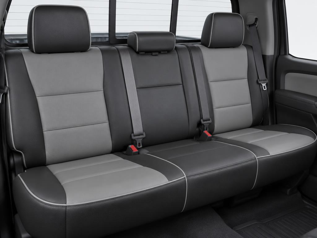 Two tone leather rear bench seat installed in a pickup truck cab