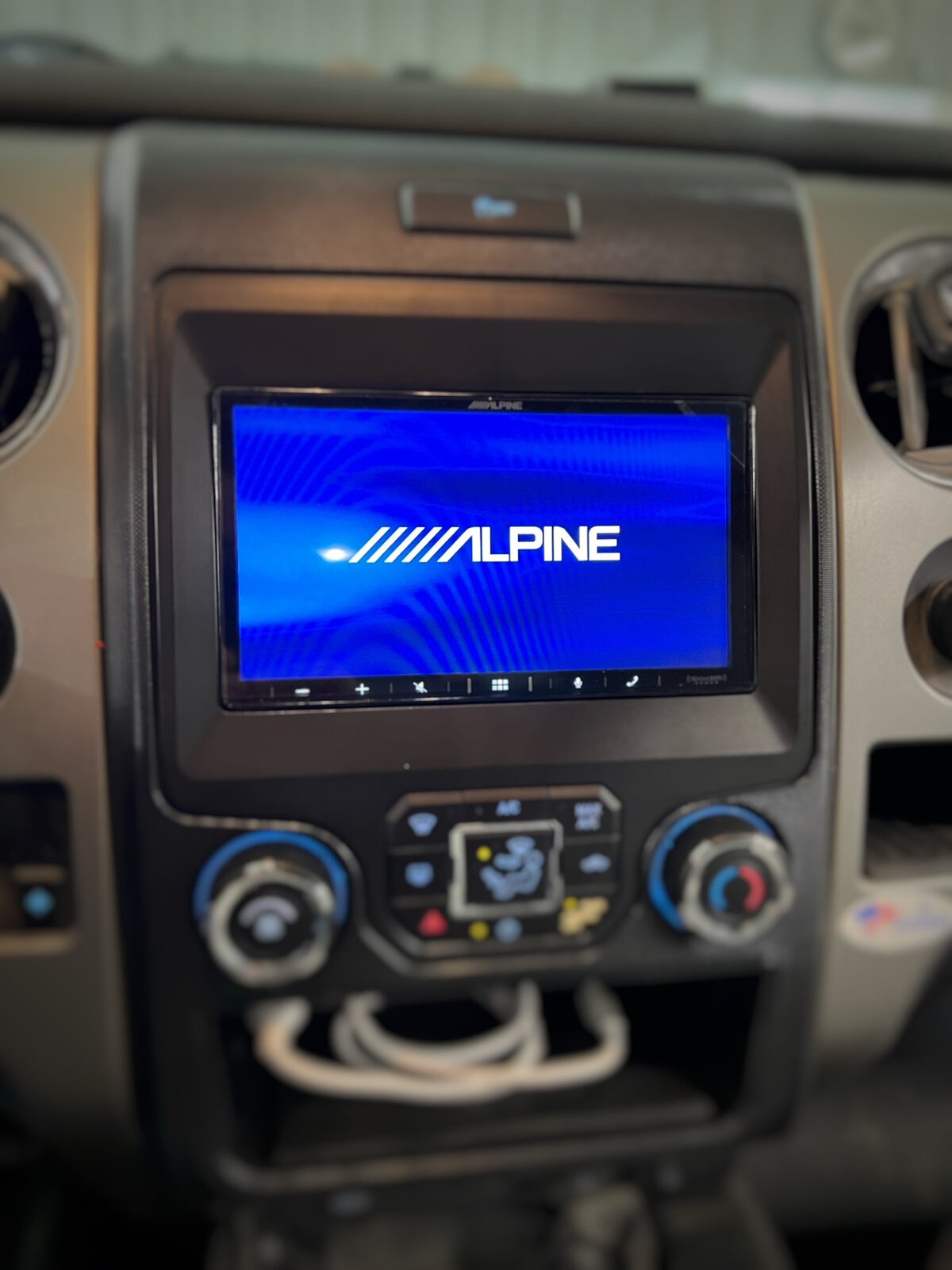Alpine touchscreen receiver installed in a pickup truck dashboard