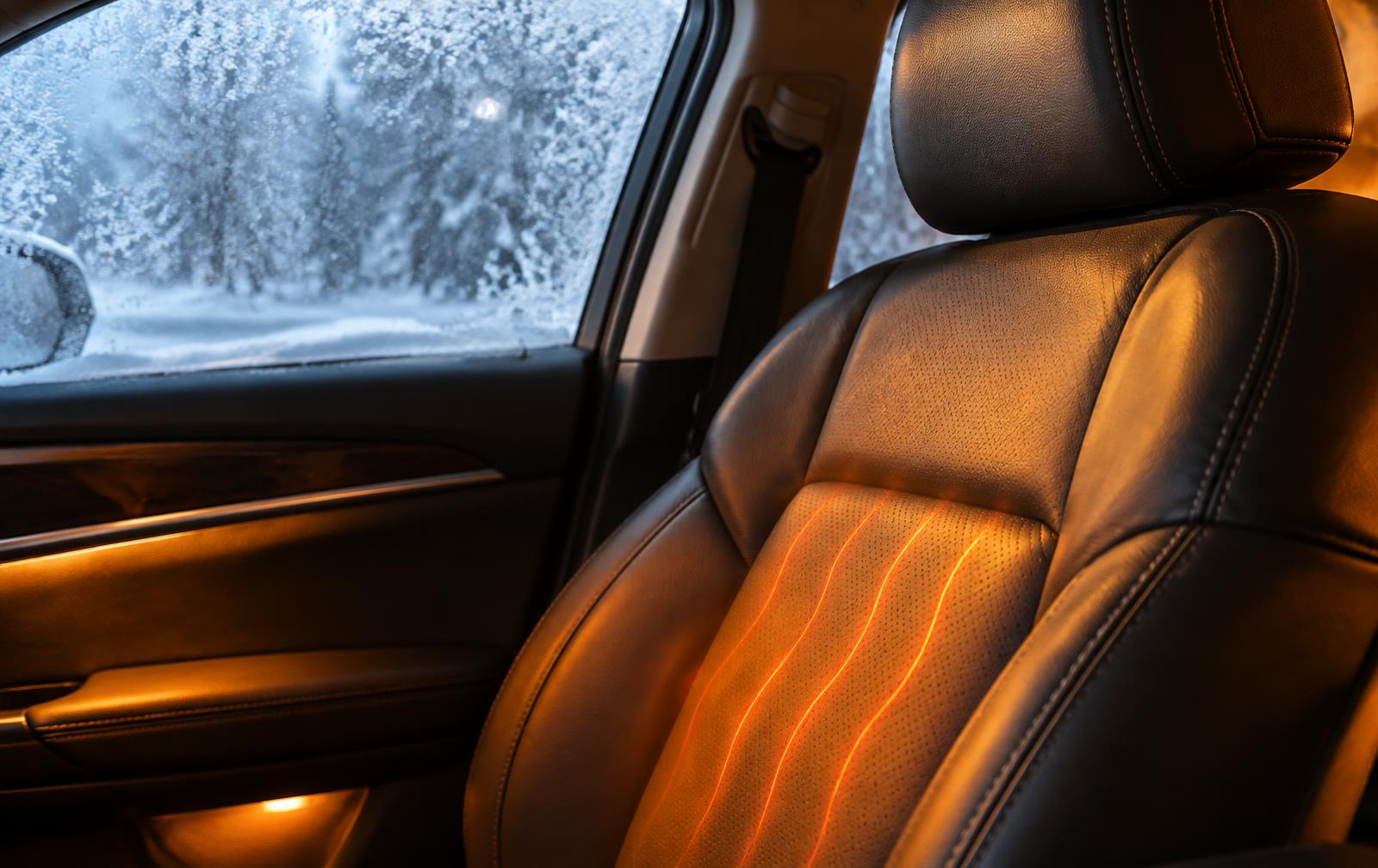 Heated leather car seat with frost on the window during an Iowa winter